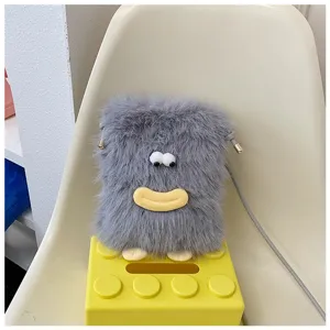 Grey plush mini crossbody phone bag detail, cute fuzzy texture with funny eyes and mouth.