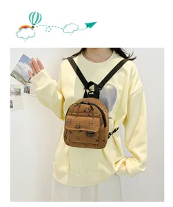 Detail view of a cute brown corduroy mini backpack with adorable panda print for daily use.