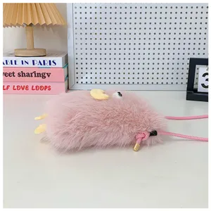Close-up detail of the cute pink plush crossbody phone bag with soft furry texture and strap.