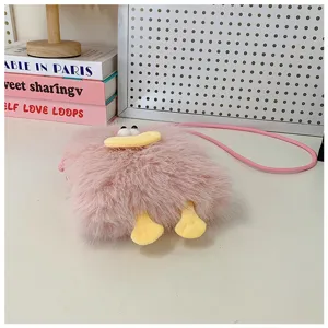 Pink plush cartoon duck cross body bag detail view, cute fuzzy shoulder bag with funny lip.