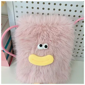 Close-up of the cute pink fluffy crossbody bag featuring funny eyes and yellow plush smile.