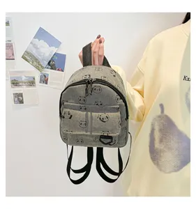 Cute mini corduroy backpack for women, casual small bookbag with adorable panda print pattern.