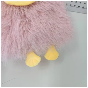 Cute pink plush crossbody phone bag with funny yellow duck beak and feet design details.