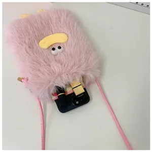 Cute pink plush phone bag detail showing fluffy texture, funny lip decor and strap.