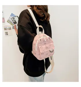 Detail view of cute pink mini corduroy backpack with lovely panda pattern and comfy straps.