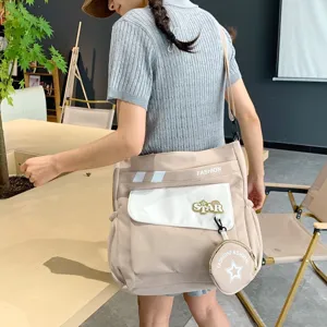 Sac bandoulière élégant en toile pour femmes, grand sac décontracté avec petite pochette.