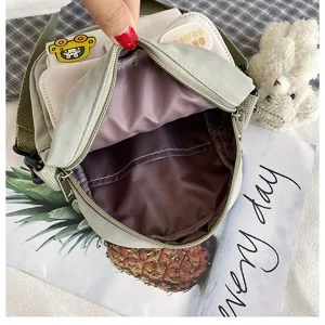 Detailed view of a cute Japanese style canvas crossbody bag interior pocket and zipper design.
