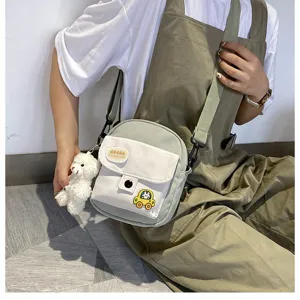 Cute Japanese style canvas crossbody bag for daily student use with bear pendant.