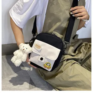 Canvas crossbody bag for women, cute small shoulder bag with plush bear pendant and patches.
