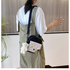 Korean Harajuku style canvas crossbody bag for cute teen girls with bear pendant.