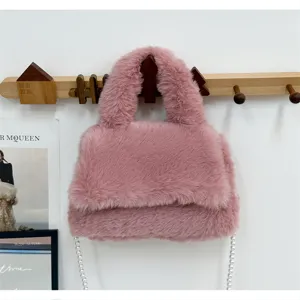 Korean style pink fluffy handbag with elegant pearl chain strap and soft plush finish for women.