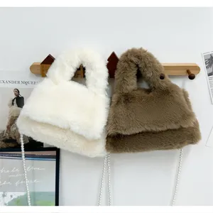 Fluffy faux fur shoulder bag for women, cute winter plush handbag with elegant pearl chain strap.