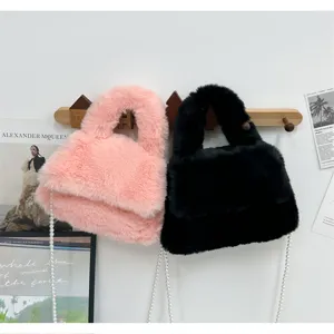 Plush furry handbag with pearl chain, fuzzy shoulder bag detail view, soft winter style.