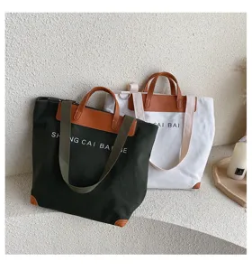 Canvas tote bag for women, large capacity shoulder crossbody handbag with letter print design.