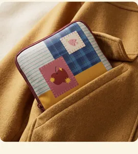 Close-up detail of the portable colorful jewelry storage bag with cute patch patterns.