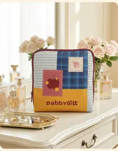 Detail shot of the colorful dopamine jewelry storage bag featuring a multi-pattern patchwork.