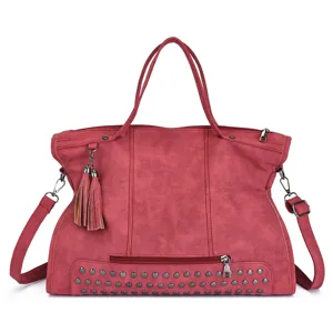 Vintage PU leather tote bag for women, stylish studded shoulder crossbody bag with tassel.