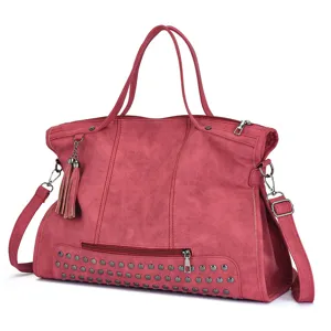 Retro red PU leather shoulder bag with chic metal rivets, tassels, and spacious design.