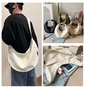 Detailed view of casual nylon dumpling shoulder bag showing large capacity and multiple color options.