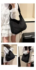 Casual large capacity canvas shoulder bag for women, versatile black crossbody tote bag.