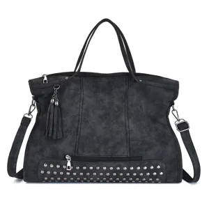 Black vintage PU leather shoulder bag detail with metal studs, tassels and front zipper pocket.