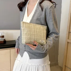 Classic tweed cosmetic pouch with elegant plaid pattern, portable storage bag for daily makeup.