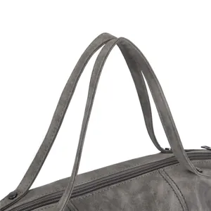 Grey suede PU leather handbag handle detail shot, premium minimalist texture craftsmanship accessory.