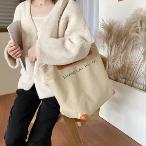 Canvas tote shoulder bag for women, casual large capacity handbag with brown leather flap trim.