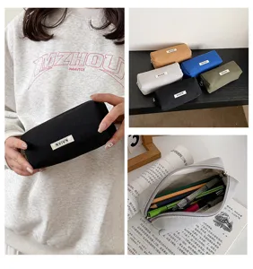 Canvas pencil case detail view showing large capacity, durable zipper and neat student storage.