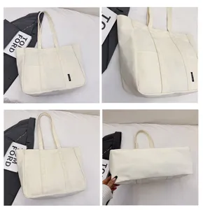 Canvas tote bag for women, large capacity casual shoulder bag, daily commuting multi-pocket handbag.