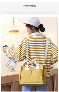 Yellow canvas tote bag for women, large capacity shoulder bag with multiple pockets and straps.