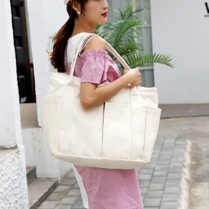 Large capacity canvas tote bag for women, stylish casual shoulder handbag with multi pockets.