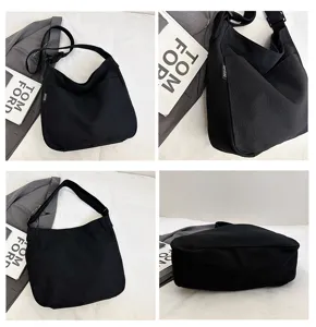 Detailed view of the casual black canvas shoulder bag, large capacity slouchy hobo tote for daily.