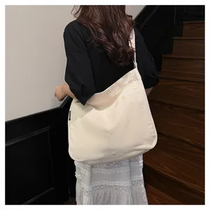 Casual large capacity canvas shoulder bag for women, stylish tote bag for daily use and college.