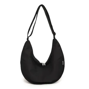 Black nylon dumpling shoulder bag, minimalist casual crossbody bag with large capacity.
