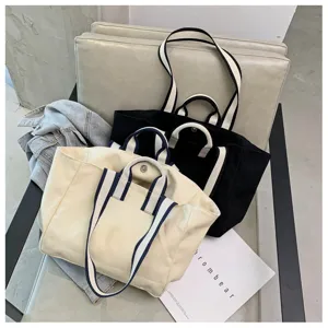 Minimalist large capacity canvas tote bag, versatile casual shoulder bag for daily commuting.