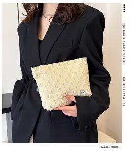 Stylish casual canvas makeup bag with distressed design, portable travel storage pouch for women.