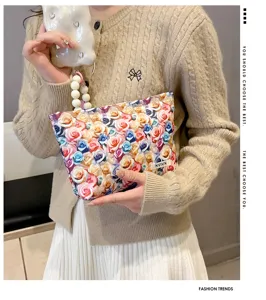 Floral cosmetic bag with pearl handle, trendy large capacity makeup pouch for women and girls.