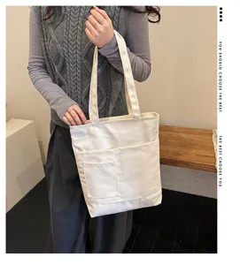 Canvas tote bag large capacity shoulder bag multi-pocket casual student book bag.