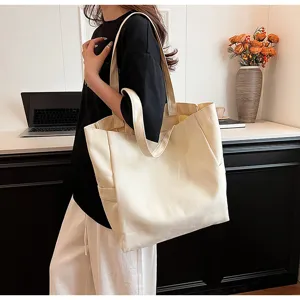 Detailed view of the casual canvas tote bag, featuring sturdy straps and large capacity.