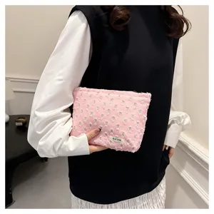 Pink distressed linen cosmetic bag, portable travel storage pouch for daily toiletries use.
