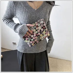 Floral print cosmetic bag, portable canvas makeup pouch, stylish travel storage organizer for use.