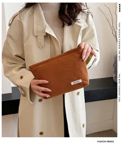 Solid color brown corduroy makeup bag, stylish portable clutch pouch for daily storage needs.