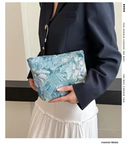 Detailed view of the stylish floral jacquard cosmetic bag, elegant design for daily use.