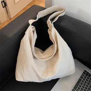 Detailed view of a casual canvas shoulder bag, minimalist hobo style, large capacity design.
