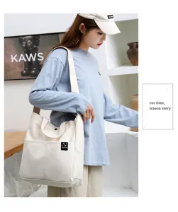 Casual canvas tote bag detail, minimalist shoulder shopping bag for daily commuting and school use.