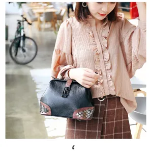 Stylish women shoulder handbag with metal lock and rivets, perfect for daily autumn fashion wear.