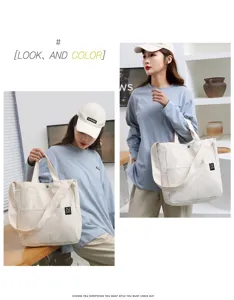 Canvas tote bag casual shoulder bag with outer pocket and crossbody strap detail for daily use