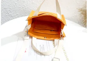Casual canvas bento tote bag for students, orange shoulder and messenger bag with inner pocket.
