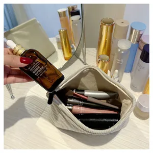 Corduroy cosmetic bag for women, solid color makeup pouch, zipper closure storage bag.